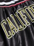  - FAITH CONNEXION - 'California' appliqué faux leather basketball shorts