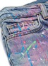  - AMIRI - 'Graffiti' button front paint splatter ripped jeans