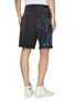 Back View - Click To Enlarge - AMIRI - 'Thrasher' paint splatter print ripped denim shorts