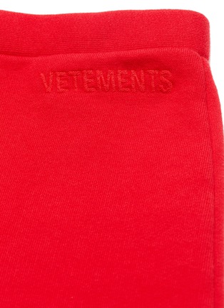  - VETEMENTS - Logo embroidered flared sweatpants