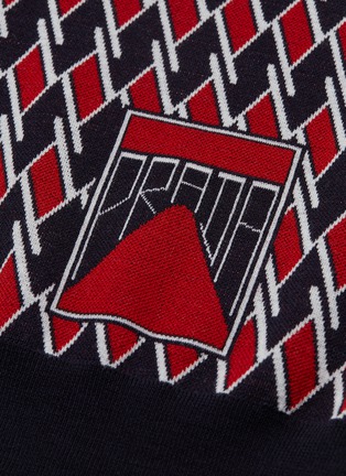  - PRADA - Logo appliqué geometric print virgin wool polo shirt