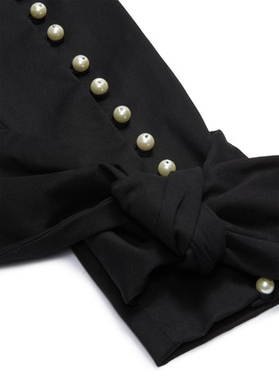 Detail View - Click To Enlarge - LEAL DACCARETT - 'Francisca' bow tie faux pearl cuff skinny pants