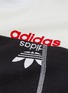  - ADIDAS ORIGINALS BY ALEXANDER WANG - 'Disjoin' 3-Stripes sleeve logo print colourblock cropped top