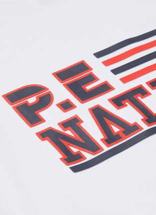  - P.E NATION - 'Blacktop' logo print raglan sweatshirt