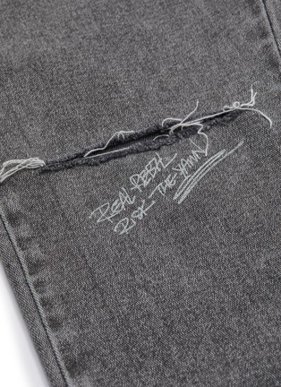  - GROUND ZERO - Asymmetric ripped flared jeans