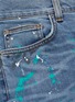  - AMIRI - 'Graffiti' paint splatter print ripped jeans