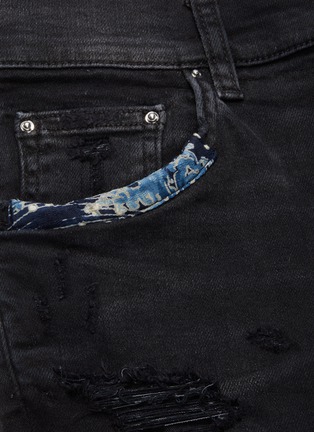  - AMIRI - Paint splatter print mix patch ripped jeans
