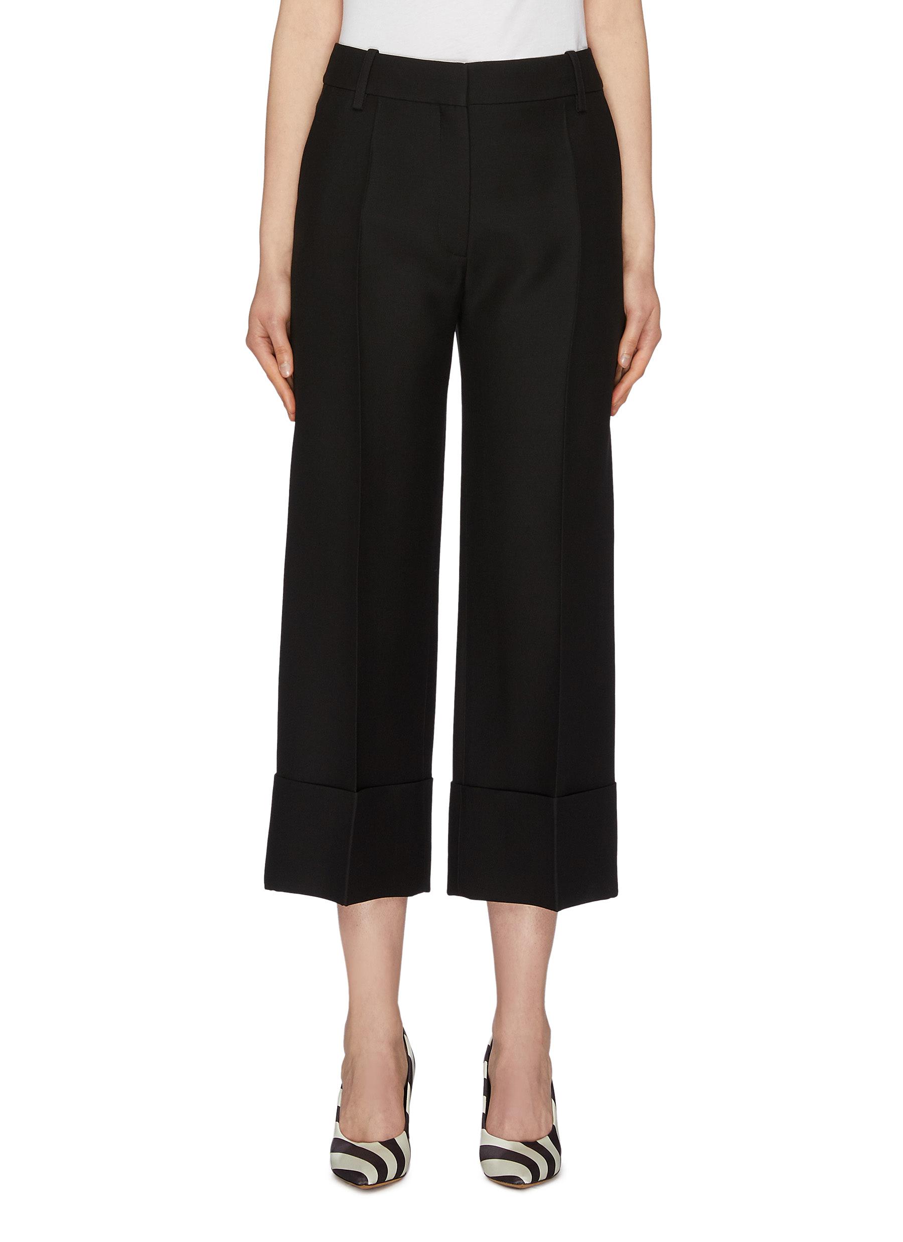 Roll cuff pleated virgin wool-silk crepe pants by Valentino