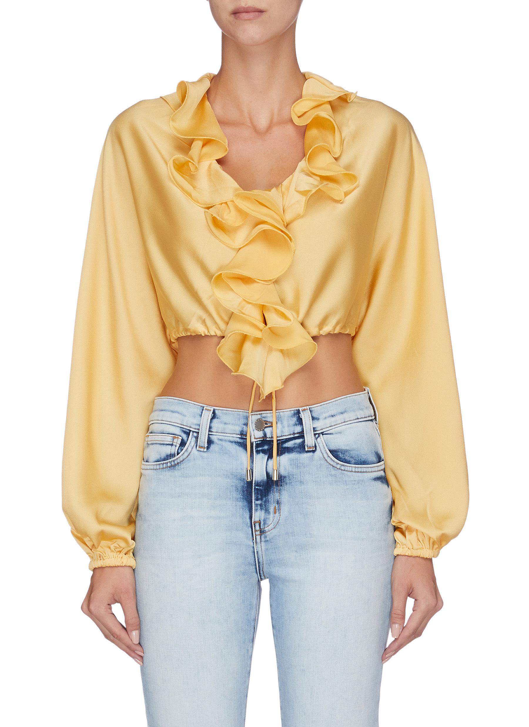 Knowing of this cropped jabot top by C/Meo Collective