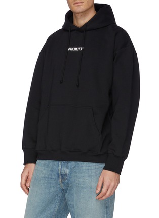 Front View - Click To Enlarge - VETEMENTS - Inverted logo print washing label hoodie
