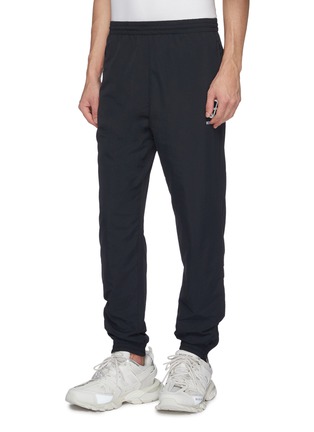 Front View - Click To Enlarge - VETEMENTS - 'Anarchy' logo print track pants