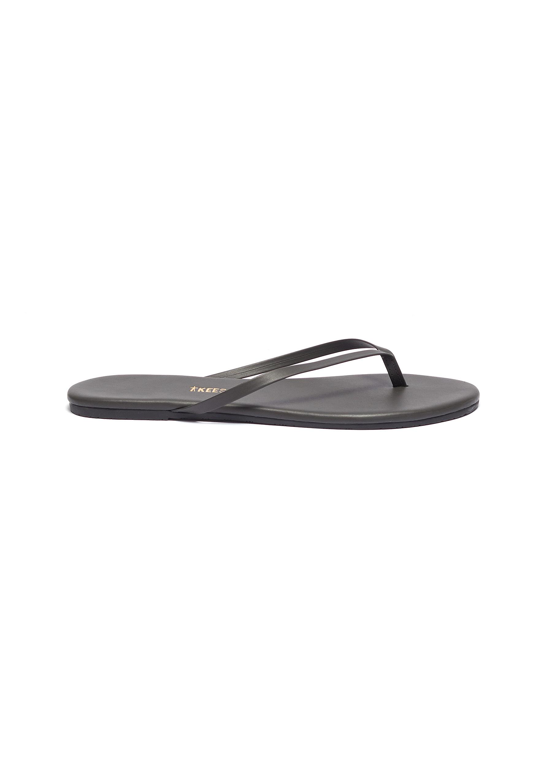 Solids leather flip flops by Tkees