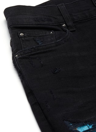  - AMIRI - Hawaiian print patch distressed skinny jeans