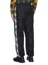 Back View - Click To Enlarge - ACNE STUDIOS - Face motif stripe track pants
