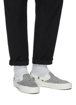 white canvas slip on vans