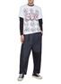 Figure View - Click To Enlarge - COMME DES GARÇONS SHIRT - Comme Des Garçons x Kaws Pink CDG Print T-Shirt