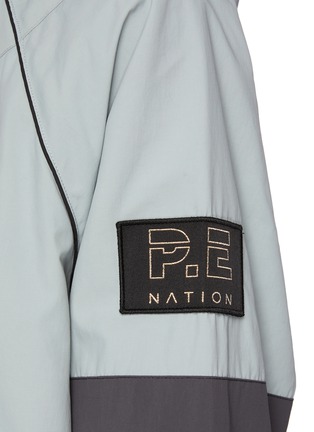  - P.E NATION - Game Day' Drawstring Nylon Zip Up Jacket