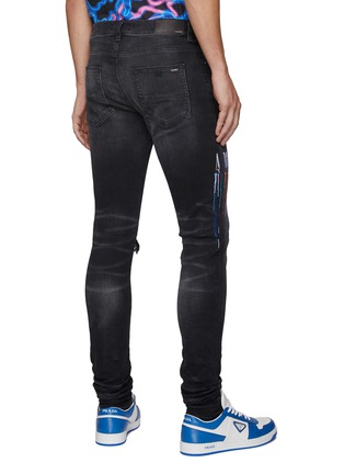 Back View - Click To Enlarge - AMIRI - PAINT DRIP LOGO EMBROIDERED DARK WASH RIPPED KNEE SKINNY JEANS