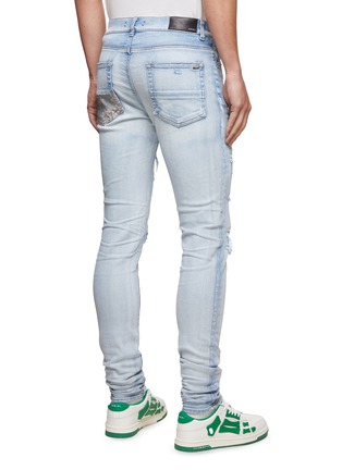 Back View - Click To Enlarge - AMIRI - HIBISCUS ARTPATCH DISTRESS DETAILS LIGHT WASH JEANS