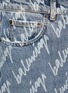 BALENCIAGA - Cursive logo print denim jeans