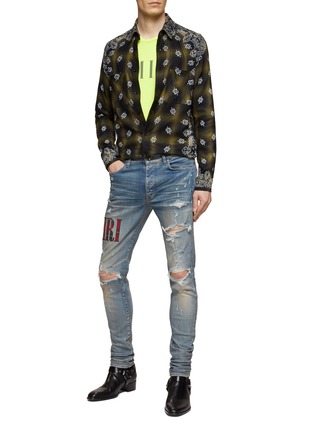 Figure View - Click To Enlarge - AMIRI - LIGHT WASH DISTRESSED FLANNEL CORE SIDE LOGO KNEE SLITS SKINNY JEANS