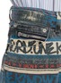  - SACAI - x Eric Haze 'One Kind World' Slogan Print Cropped Bootcut Jeans