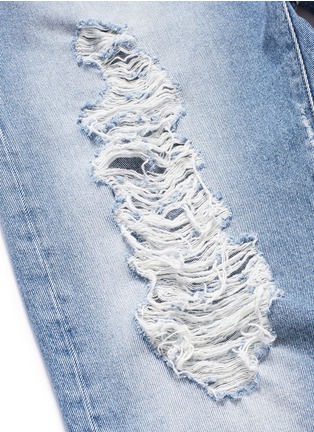  - PALM ANGELS - Vintage wash cropped ripped jeans