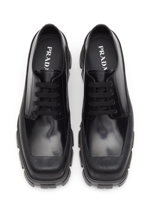Detail View - Click To Enlarge - PRADA - ‘Monolith’ Logo Appliqué Spazzalato Leather Penny Loafers