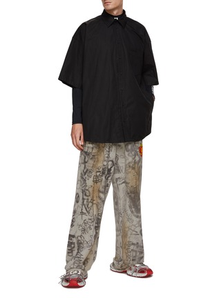 Figure View - Click To Enlarge - BALENCIAGA - All Over Graffiti Print Ripped Baggy Sweatpants
