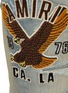  - AMIRI - Varsity Eagle Logo Distressed Skinny Jeans