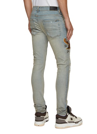 Back View - Click To Enlarge - AMIRI - Varsity Eagle Logo Distressed Skinny Jeans