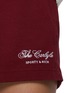  - SPORTY & RICH - The Carlyle Script Disco Shorts