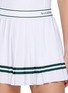  - SPORTY & RICH - Serif Logo Waistband Pleated Mini Skirt
