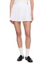 SPORTY & RICH Monogram Embroidered Pleated Cotton Mini Skirt