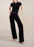 Detail View - Click To Enlarge - SILKY MIRACLE - Nude Flared Leg Trousers — Black/Size M