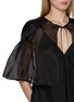  - THE LOOM - Cut Out Tie Front Cape Silk Top