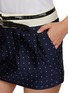  - HOMMEGIRLS - Belted Embroidered Mini Skirt