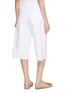 Back View - Click To Enlarge - MOTHER - The Whole Lot Zip Twist Fray Charm Light Wash Jeans