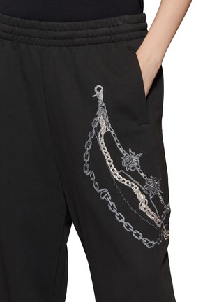  - WE11DONE - Chain Embroidered Sweatpants