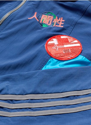 - ADIDAS BY PHARRELL WILLIAMS - Reflective logo embroidered windbreaker jacket
