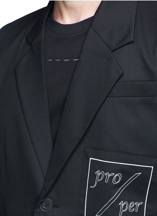 Detail View - Click To Enlarge - THE WORLD IS YOUR OYSTER - Slogan embroidered asymmetric twill blazer