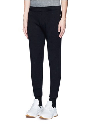 Front View - Click To Enlarge - NEIL BARRETT - Thunderbolt embroidered bonded jersey jogger pants