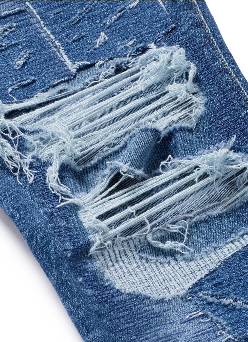 AMIRI MX0补丁破洞修身牛仔裤