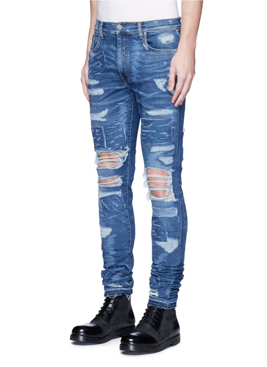 AMIRI MX0补丁破洞修身牛仔裤