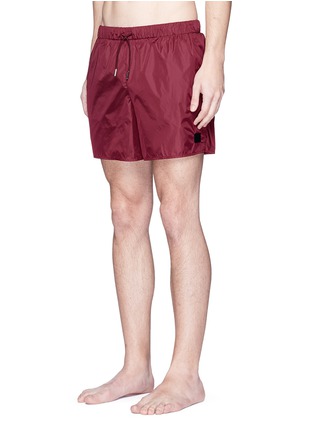 Figure View - Click To Enlarge - ACNE STUDIOS - 'Perry' face patch swim shorts