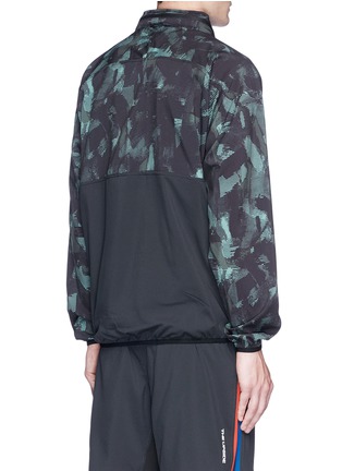 Back View - Click To Enlarge - THE UPSIDE - 'Sketchy Camo' packable hood jacket