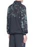 Back View - Click To Enlarge - THE UPSIDE - 'Sketchy Camo' packable hood jacket