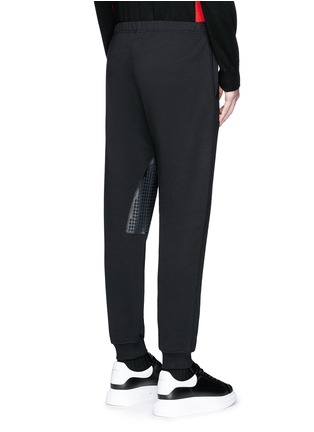 Back View - Click To Enlarge - ALEXANDER MCQUEEN - Perforated leather patch jogging pants