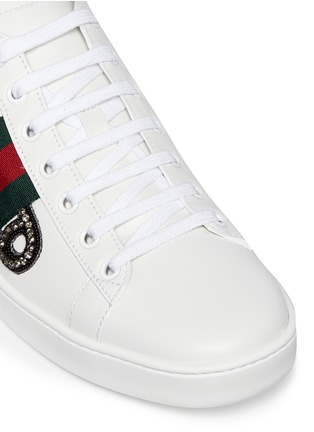 Detail View - Click To Enlarge - GUCCI - 'Ace' safety pin embellished leather sneakers