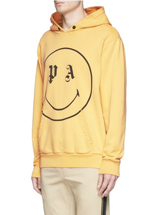 Front View - Click To Enlarge - PALM ANGELS - x Smiley® logo print cotton hoodie